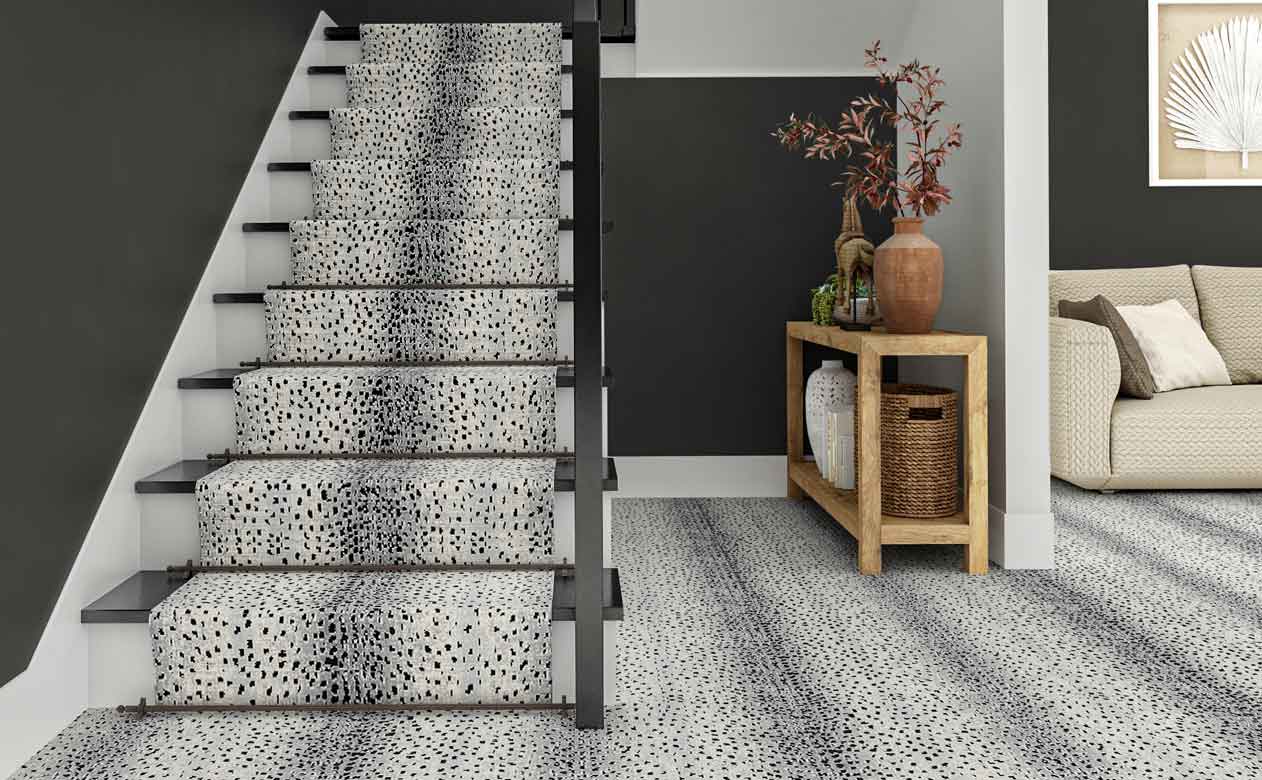 patterned carpet in an entrwyay with matching stair runner